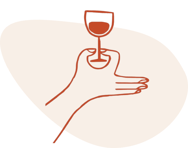 Main tenant un verre de vin